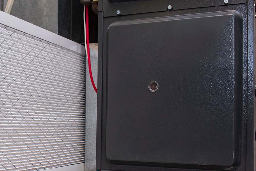 black HVAC component with a filter