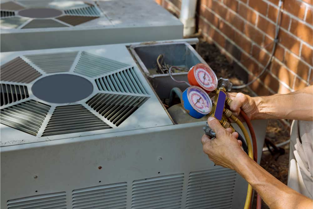 AC maintenance technician at work