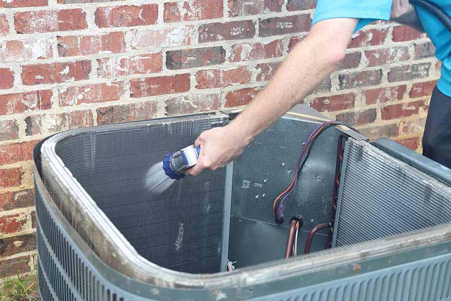 AC coil cleaning in progress